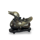 A Grey and Black Jade Duck, 19th/20th century L:19.5cm carved in Ming style, the bird seated bearing