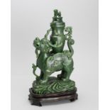 A spinach green Jade Qilin Vase and Cover, 20th century H: 30.5cm, L: 17cm the rich dark stone