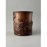 A Bamboo Brushpot H:14cm carved in relief with a lady reclining by a rock table in a garden