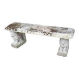 A RECONSTITUTED STONE GARDEN BENCH With seated lion supports. (137cm x 38cm x 46cm) Condition: