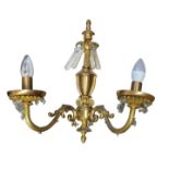 A SET OF SIX REGENCY STYLE GILT BRONZE AND CRYSTAL HUNG TWIN BRANCH WALL SCONCES With acanthus and