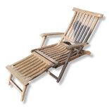 A WEATHERED TEAK GARDEN LOUNGER/STEAMER CHAIR With brass fittings. (192cm x 62cm x 78cm)