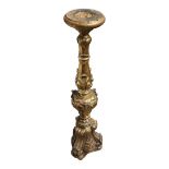 A 17TH CENTURY STYLE CARVED GILTWOOD FLOOR STANDING CANDLE STAND. (86cm) Condition: good overall,