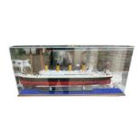 A LARGE 20TH CENTURY WOODEN HAND MADE SCALE MODEL OF THE SHIP TITANIC On a wooden base in perspex