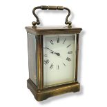 AN EARLY 20TH CENTURY GILT BRASS CARRIAGE CLOCK Having a single carry handle and four panels. (