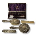 A VINTAGE SILVER DRESSING TABLE SET Comprising a hand mirror, hairbrush, clothes brush and comb,