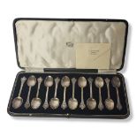 A SET OF TWELVE VINTAGE BRITANNIA SILVER TEASPOONS Having engraved decoration to the finial and