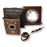 W. WATSON & SONS FULL PLATE WOODEN BELLOWS CAMERA. Alloy fittings, in several parts, GG missing,