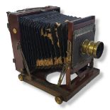 THORNTON PICKARD IMPERIAL HALF PLATE LARGE FORMAT WOODEN CAMERA WITH TRIPLE EXTENSION BELLOWS.