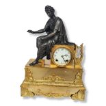 A 19TH CENTURY FRENCH GILT AND PATINATED BRONZE FIGURAL MANTLE CLOCK Depicting a classical