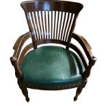 AN EARLY 20TH CENTURY OAK ARTS AND CRAFTS LIBARY CHAIR With green faux leather upholstered seat. (