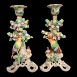 A LATE 19TH CENTURY PAIR OF CONTINENTAL AUSTRIAN VIENNA STYLE PORCELAIN ORNAMENTAL CANDLESTICKS