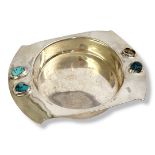 LIBERTY, A CYMRIC SILVER AND TURQUOISE OVAL COASTER Set with cabochon cut stones, marked to rear