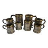 A GOOD MIXED COLLECTION OF SEVEN GEORGIAN PEWTER AND BRASS TANKARD S Quart, pint and hay pint etc,