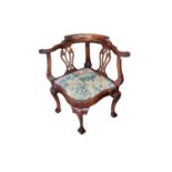 A GEORGIAN STYLE MAHOGANY CORNER CHAIR With pierced vase splat backs, serpentine shaped floral