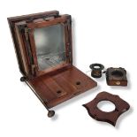 LANCASTER & SONS, LADIES CAMERA. Wood and brass half plate large format camera. Shield shaped