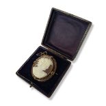 A LARGE 19TH CENTURY YELLOW METAL AND SHELL CAMEO BROOCH Having applied decoration to an oval frame,