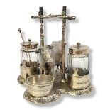 A VICTORIAN SILVER PLATE AND CUT GLASS COW CRUET SET Having a single carry handle, engraved