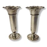 A PAIR OF EARLY 20TH CENTURY SILVER TRUMPET VASES Having a scalloped edge and round base. (approx