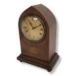 AN EDWARDIAN MAHOGANY AND SATINWOOD LANCET FORMED MANTLE CLOCK With later quartz movement. (h