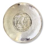 MAX LE VERRIER, 1871 - 1973, A SILVER ON BRONZE SHALLOW CHARGER/DISH With embossed decoration of a