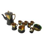 A RARE ART DECO CARLTON WARE PORCELAIN AVANT-GARDE COFFEE SERVICE FOR SIX, CIRCA 1935 Gilt