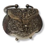 AN EARLY 20TH CENTURY PERSIAN WHITE METAL CLUTCH BAG Having a single carry handle and pierced floral