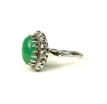 WHITE METAL, LARGE OVAL CABOCHON EMERALD AND ROSE CUT DIAMONDS RING. Emerald 4.00ct approx. Diamonds
