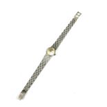 DELMONT, SWITZERLAND, AN 18CT WHITE GOLD LADIES WRISTWATCH On a textured strap. (26.5g)