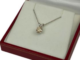 AN 18CT WHITE GOLD SOLITAIRE DIAMOND PENDANT ON A SILVER CHAIN. (Approx Diamond 0.74ct)