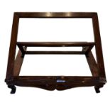 A 19TH CENTURY MAHOGANY TABLE TOP LECTERN/BOOK STAND With scrolling decoration, raised on four