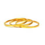 THREE 21CT GOLD BANGLES Having textured sides and polished interior and exterior finish. (diameter