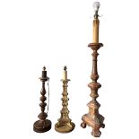 THREE 18TH CENTURY ITALIAN WALNUT, GILTWOOD AND POLYCHROME CANDLESTICKS CONVERTED TO LAMPS. (largest