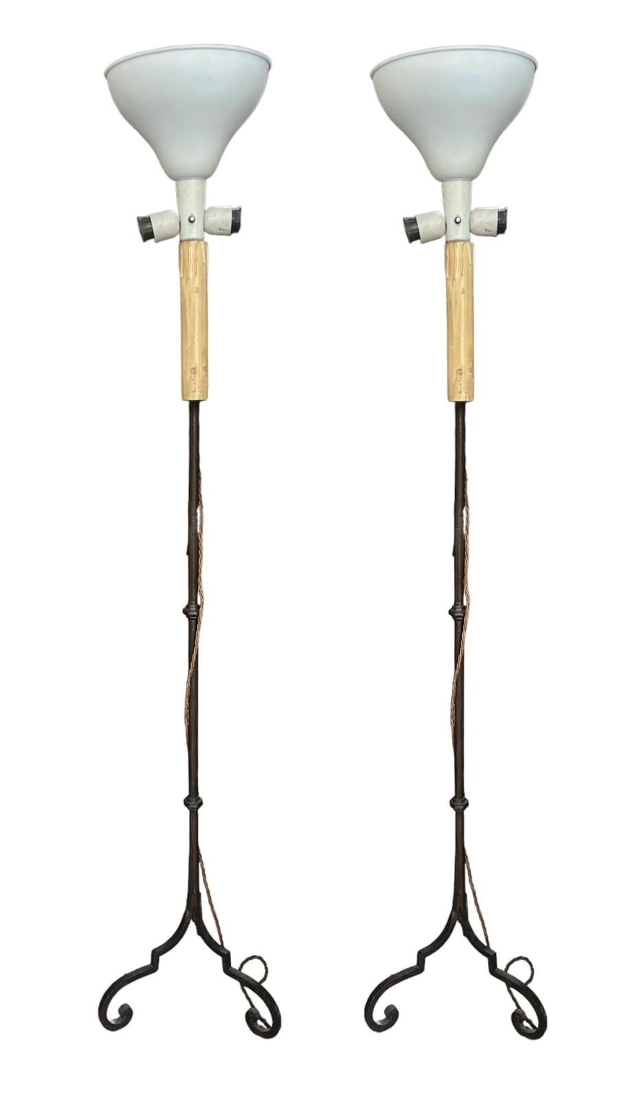 A PAIR OF 16TH CENTURY DESIGN WROUGHT IRON CANDLE STAND LAMPS Raised on triform scrolling