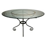 A DECORATIVE 20TH CENTURY CIRCULAR WROUGHT IRON AND GLASS TOPPED CENTRE TABLE. (h 73cm x diameter