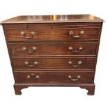 AN EARLY 19TH CENTURY MAHOGANY CHEST Of two drawers applied with brass swan neck handles, raised