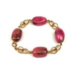 A 14CT GOLD AND RHODONITE BRACELET. (length 22.5cm, gross weight 46.8g)