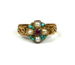 A GEORGIAN YELLOW METAL RUBY, PEARL AND TURQUOISE RING Having chased and pierced shoulders (A/F). (