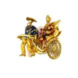 AN ORIENTAL 18CT GOLD AND ENAMEL RICKSHAW BROOCH. (26mm x 28mm, 6.4g)