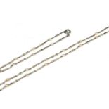 A WHITE METAL AND SEED PEARL NECKLACE AND MATCHING BRACELET, WHITE METAL TESTED AS PLATINUM. (length