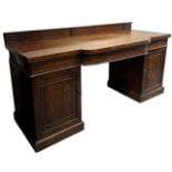 MANNER OF GILLOWS, A 19TH CENTURY REGENCY MAHOGANY BOW FRONTED SIDEBOARD With a large single