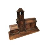 A LARGE 19TH CENTURY TRAMP ART CARVED WOOD TOWN HALL COIN BANK Having three coin slots to back and