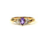 A 9CT YELLOW GOLD, PEAR SHAPED AMETHYST RING WITH HEART DIAMOND SET SHOULDERS