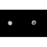 A PAIR 18CT WHITE GOLD SOLITAIRE DIAMOND STUDS. (Approx 0.20ct)