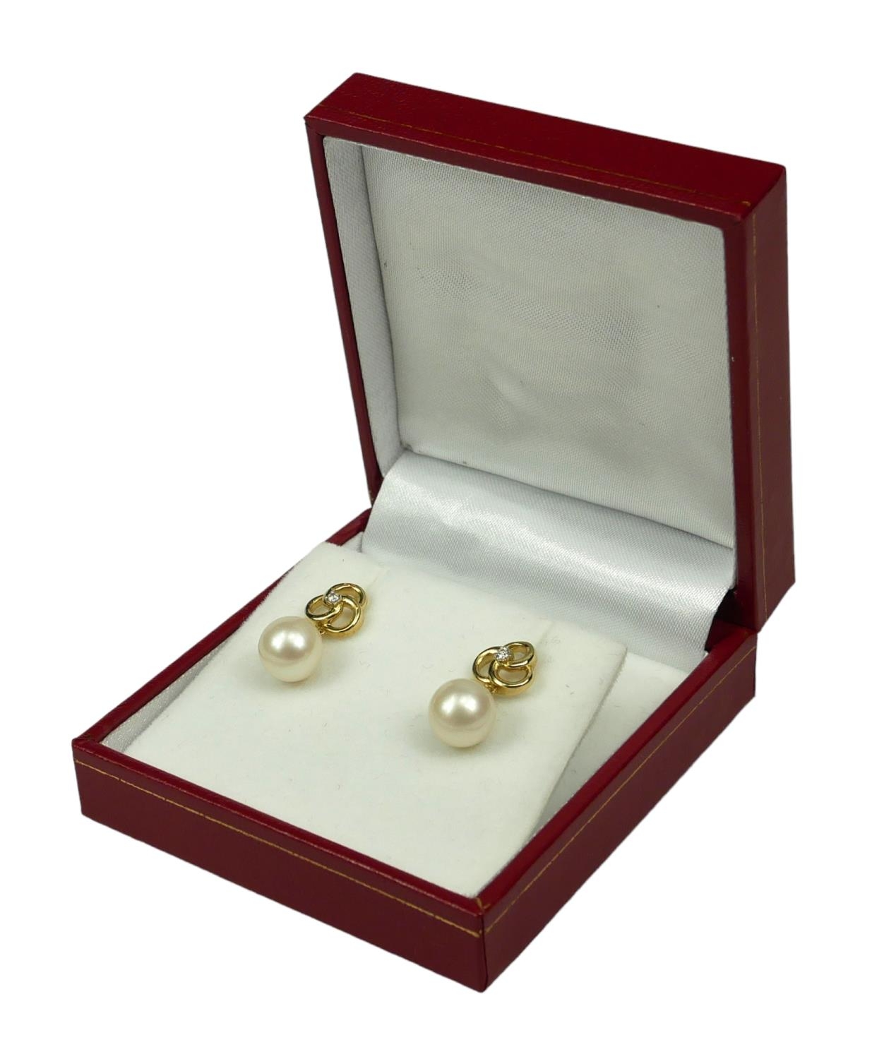 A PAIR 9CT YELLOW GOLD ROUND FRESHWATER PEARL AND DIAMOND DROP EARRINGS. (Approx Diamonds 0.05ct)