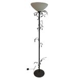 A DECORATIVE FLOORSTANDING LAMP With frosted glass shade and scrolling vines and leaves. (h 187.5cm)