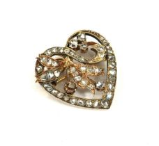 AN EDWARDIAN WHITE METAL AND DIAMOND HEART SHAPED BROOCH/PENDANT Reverse with yellow metal pin and