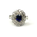 A WHITE METAL, OVAL BLUE STONE AND ROSE CUT DIAMOND RING. (Blue stone 1.00ct approx. Diamonds 0.40ct