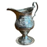 THOMAS SHEPHERD, A GEORGE III SILVER CREAM JUG, HALLMARKED LONDON, 1776 Having repoussé farmyard