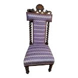 A LATE 19TH/EARLY 20TH CENTURY ROSEWOOD PRAYER CHAIR Having a shell and scroll finial ,twisted